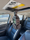 RACE MOUNTS sun visor camera mount installed with a DJI action camera
